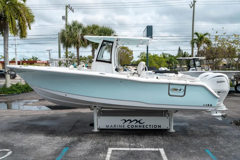 Slide: The Image of 2025 Sea Hunt Ultra 275 SE boat displayed at Marine Connection dealership. - 5
