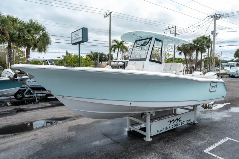Slide: The Image of 2025 Sea Hunt Ultra 275 SE boat displayed at Marine Connection dealership. - 6