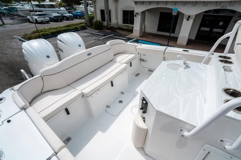 Slide: The Image of 2025 Sea Hunt Ultra 275 SE boat interior with seating and dual engines. - 12