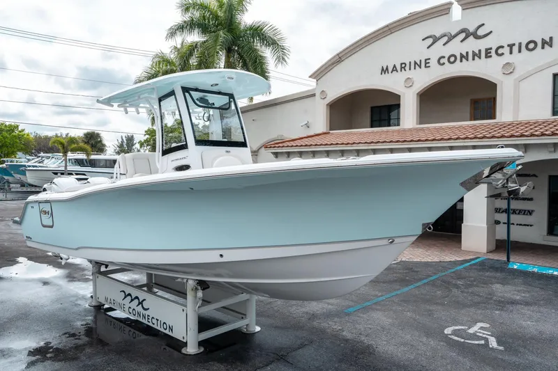 Slide: The Image of 2025 Sea Hunt Ultra 275 SE boat displayed at Marine Connection dealership. - 8
