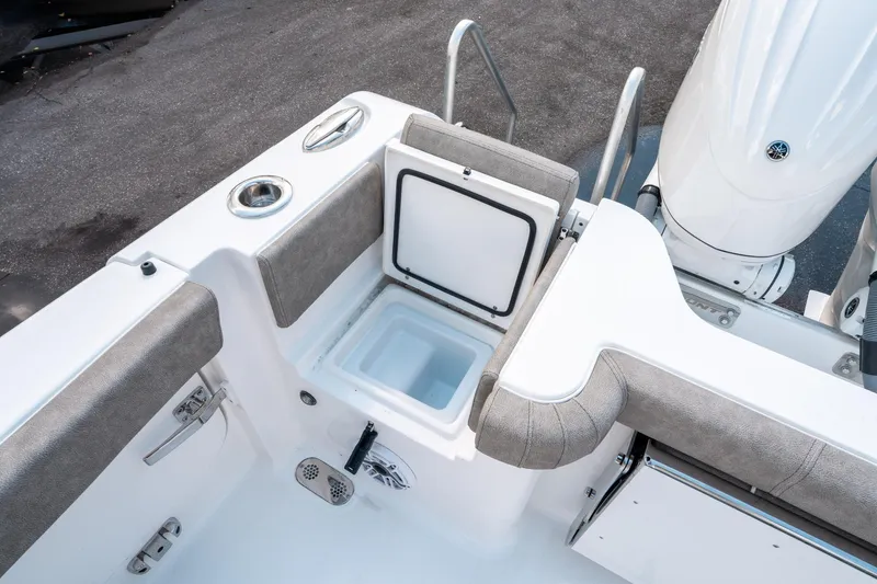 Slide: The Image of 2025 Sea Hunt Gamefish 30 CB boat interior with open storage compartment. - 15