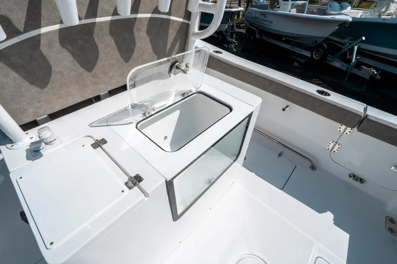 Slide: The Image of 2025 Sea Hunt Gamefish 30 CB boat interior with open storage compartment. - 19
