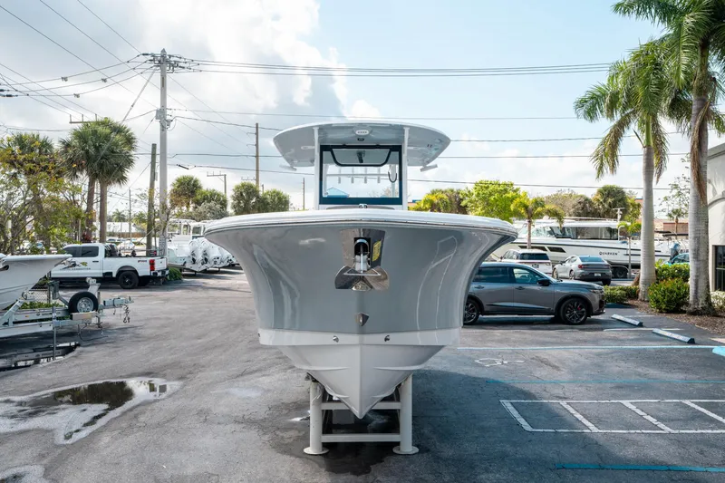 Slide: The Image of 2025 Sea Hunt Gamefish 30 CB boat in a parking lot, front view. - 7