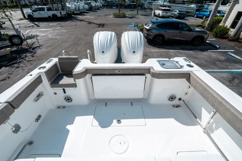 Slide: The Image of 2025 Sea Hunt Gamefish 30 CB boat interior with dual engines, spacious deck, and seating. - 10