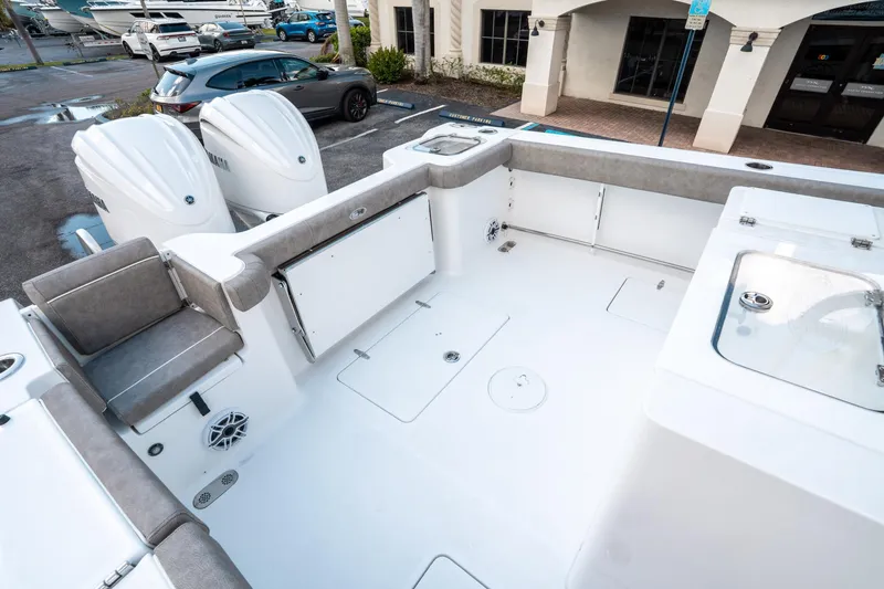 Slide: The Image of 2025 Sea Hunt Gamefish 30 CB boat interior with seating and storage compartments. - 12