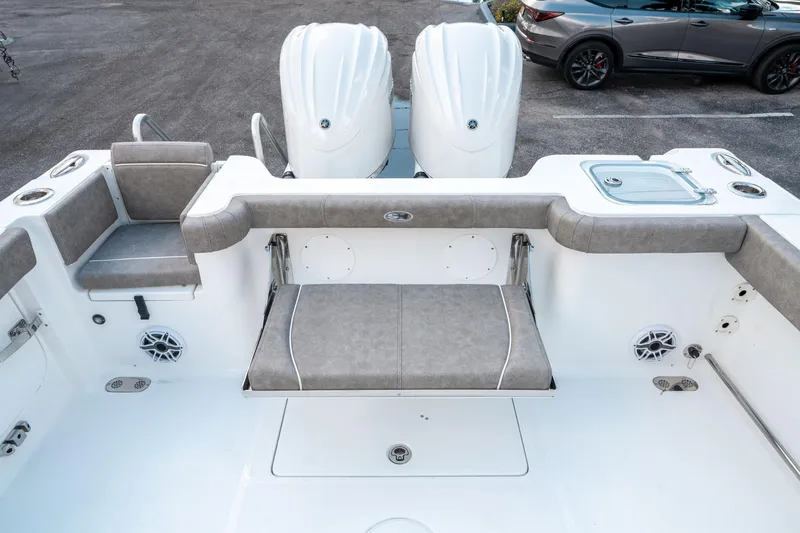 Slide: The Image of 2025 Sea Hunt Gamefish 30 CB boat interior with seating and twin engines. - 13