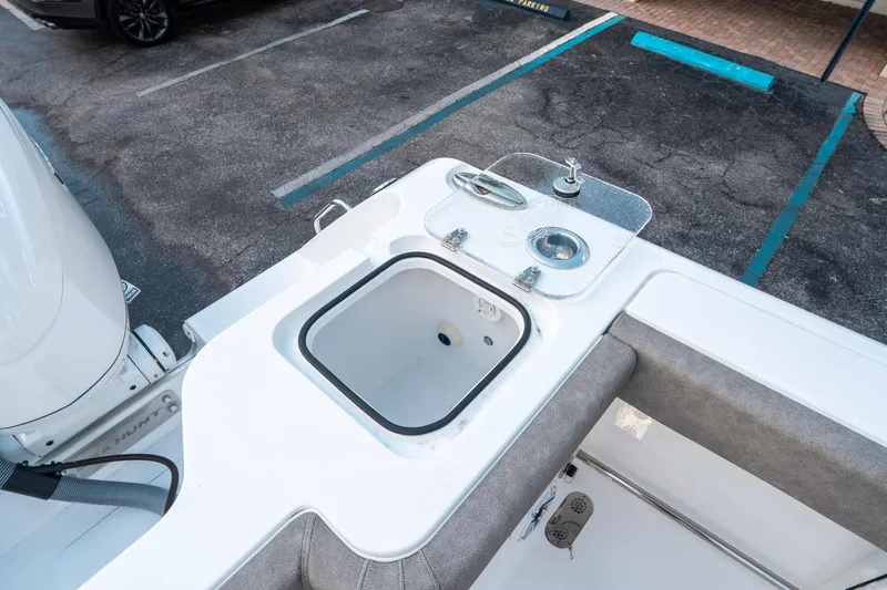 Slide: The Image of 2025 Sea Hunt Gamefish 30 CB boat with livewell and sink in the cockpit area. - 14