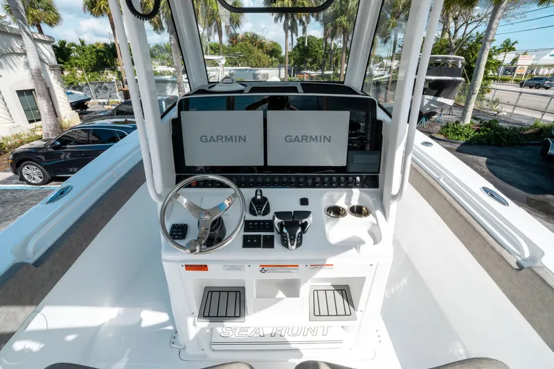 Slide: The Image of 2025 Sea Hunt Gamefish 30 CB helm with Garmin displays and modern controls. - 26