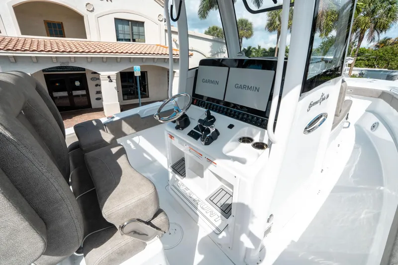Slide: The Image of 2025 Sea Hunt Gamefish 30 CB cockpit with dual Garmin displays and comfortable seating. - 27