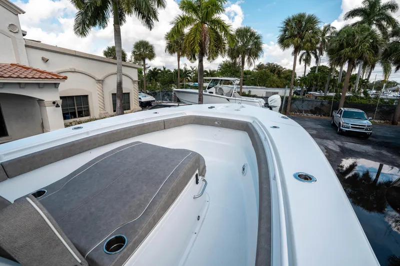 Slide: The Image of 2025 Sea Hunt Gamefish 30 CB boat, spacious deck, palm trees in background. - 35