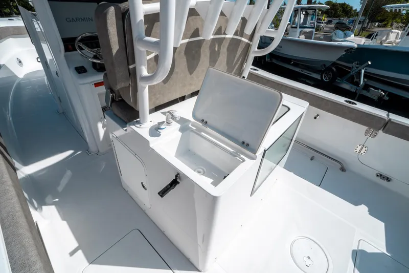 Slide: The Image of 2025 Sea Hunt Gamefish 30 CB boat interior with open storage compartment. - 20