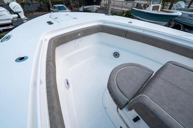 Slide: The Image of 2025 Sea Hunt Gamefish 30 CB boat interior with cushioned seating and sleek design. - 37