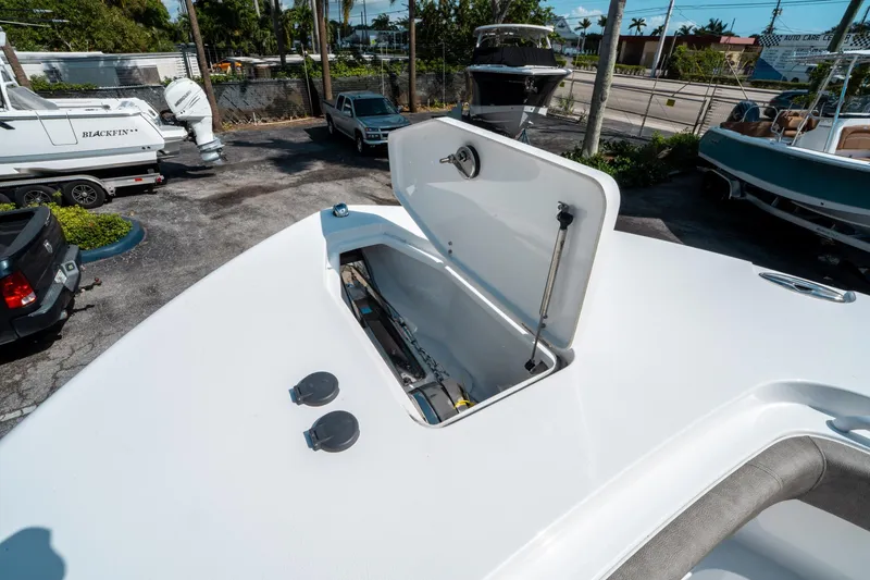 Slide: The Image of 2025 Sea Hunt Gamefish 30 CB boat with open storage compartment. - 41