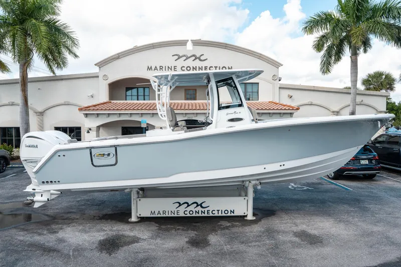 Slide: The Image of 2025 Sea Hunt Gamefish 30 CB boat displayed at Marine Connection dealership. - 1