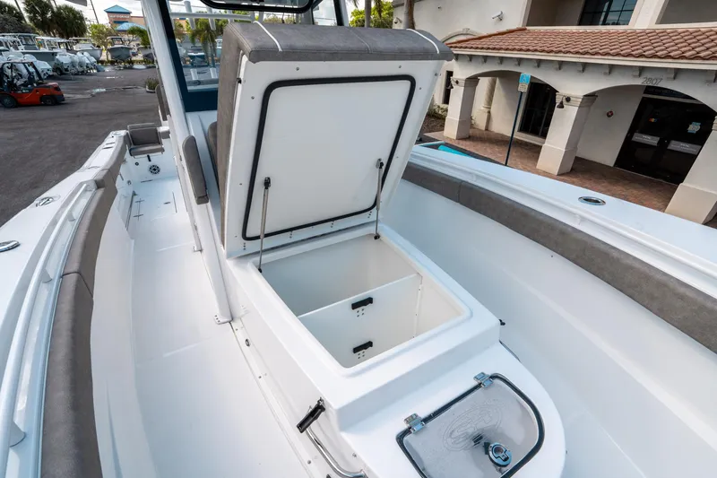 Slide: The Image of 2025 Sea Hunt Gamefish 30 CB boat interior with open storage compartment. - 40