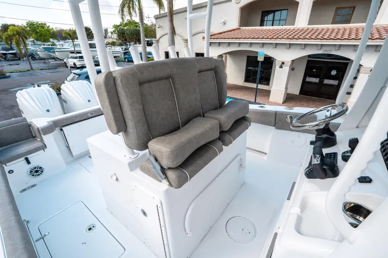 Slide: The Image of 2025 Sea Hunt Gamefish 30 CB boat interior with helm and seating. - 30