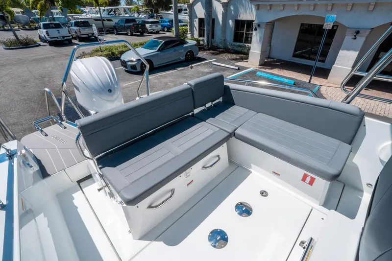 Slide: The Image of 2025 Quarken 27 T-Top boat with gray seating and modern design. - 10