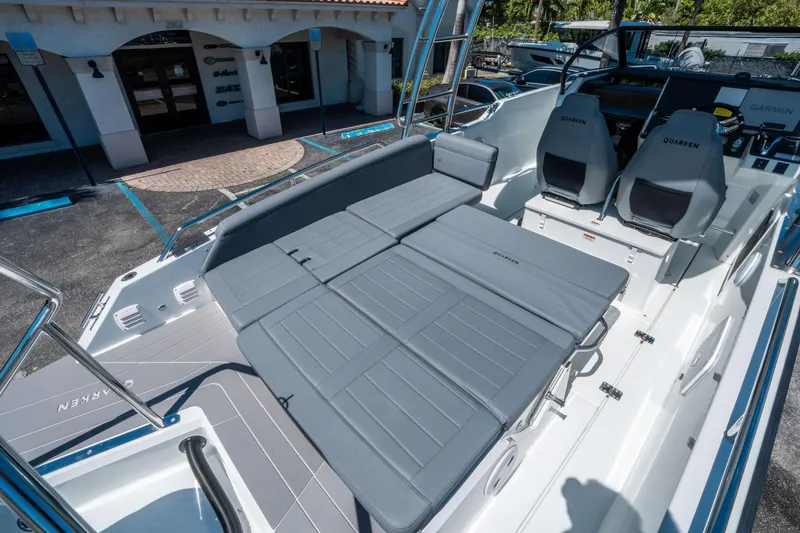 Slide: The Image of 2025 Quarken 27 T-Top boat interior with gray seating and modern design. - 21
