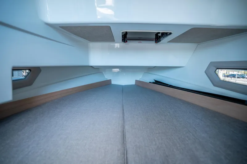 Slide: The Image of Interior cabin of 2025 Quarken 27 T-Top boat, featuring sleek design and comfortable seating. - 25