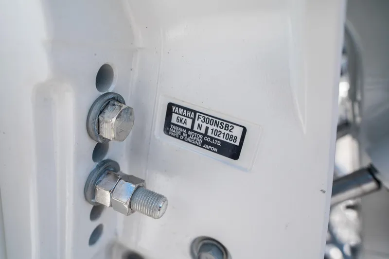 Slide: The Image of Close-up of Yamaha F300NSB2 engine label on Quarken 27 T-Top, 2025 model. - 27
