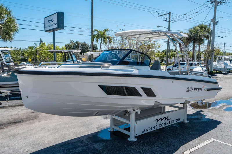 Slide: The Image of 2025 Quarken 27 T-Top boat displayed at Marine Connection dealership. - 6