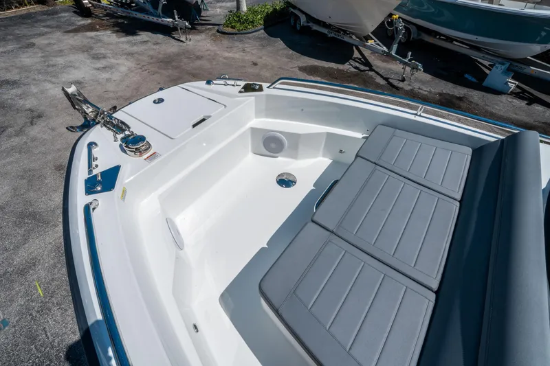 Slide: The Image of 2025 Quarken 27 T-Top boat interior with cushioned seating and anchor. - 18