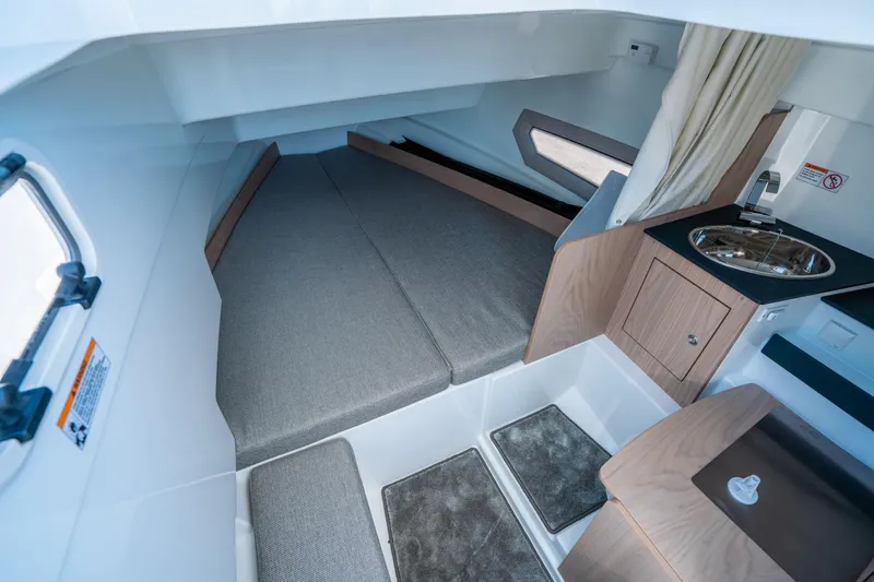 Slide: The Image of Interior cabin of 2025 Quarken 27 T-Top boat with bed and sink. - 24