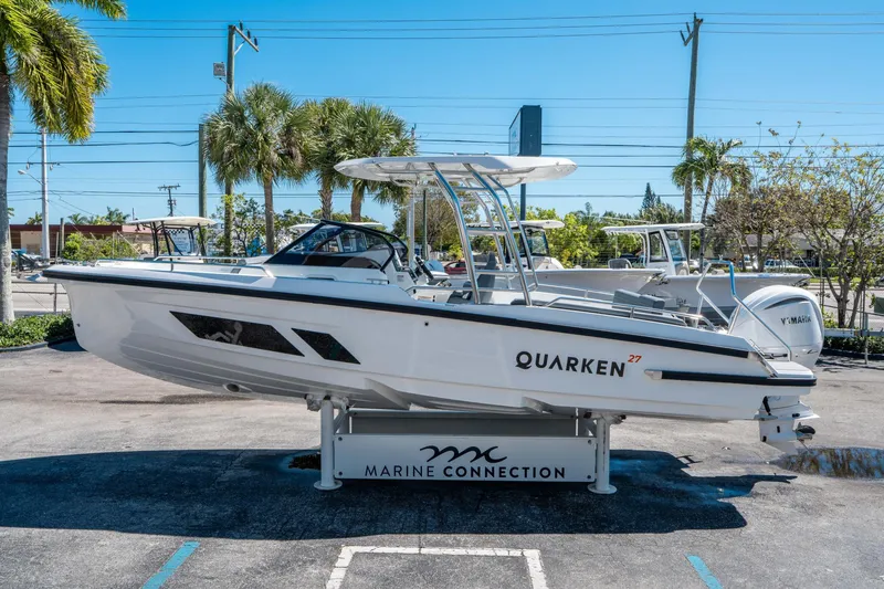 Slide: The Image of 2025 Quarken 27 T-Top boat displayed at Marine Connection dealership. - 5