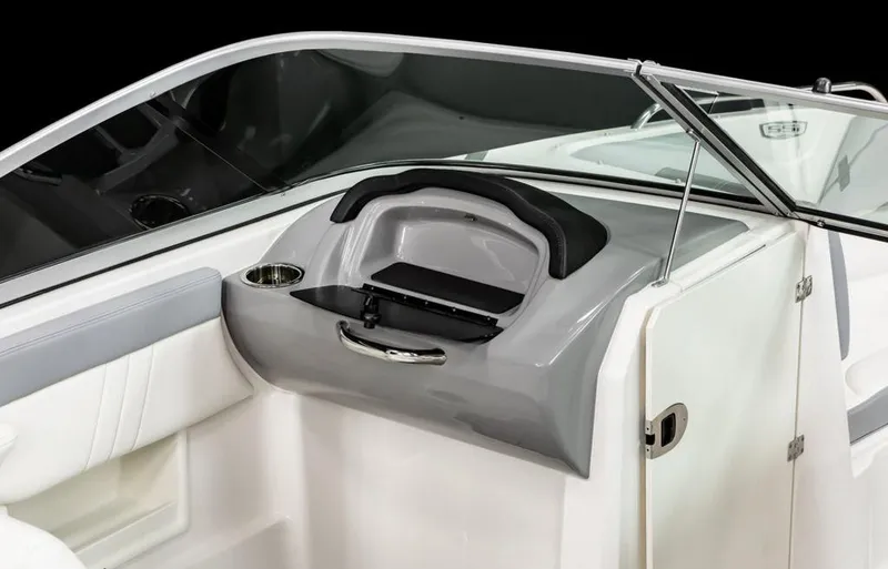 Slide: The Image of 2025 Chaparral 23 SSi OB boat interior, featuring sleek dashboard and cup holder. - 3