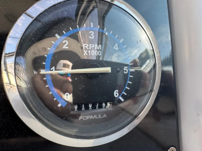 Slide: The Image of 2005 Formula 34 PC yacht interior with kitchenette, featuring sink, microwave, and modern cabinetry. - 12