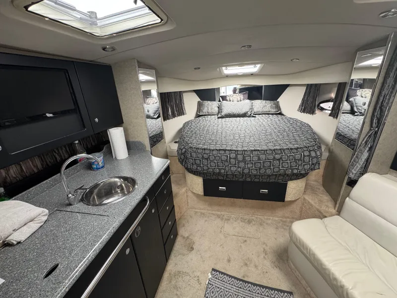 Slide: The Image of Luxurious cabin interior of a 2005 Formula 34 PC yacht with a cozy bed. - 14