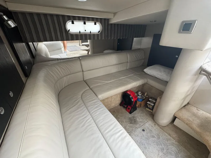 Slide: The Image of Interior of 2005 Formula 34 PC yacht with beige seating and storage area. - 19