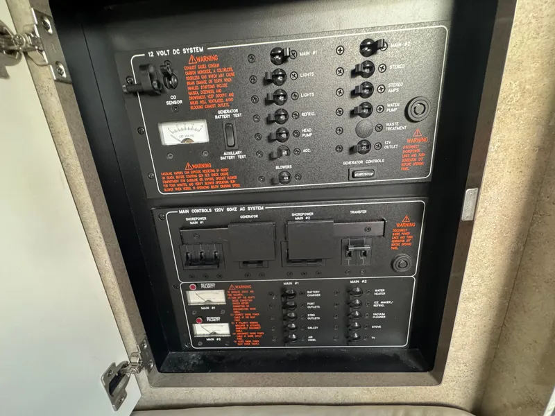 Slide: The Image of Electrical control panel of a 2005 Formula 34 PC boat, featuring various switches and indicators. - 22
