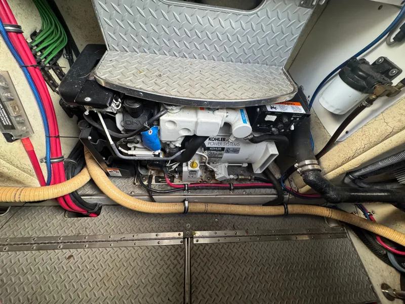 Slide: The Image of 2005 Formula 34 Performance Cruiser docked at marina, surrounded by other boats. - 27