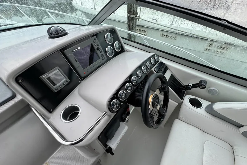 Slide: The Image of 2005 Formula 34 Performance Cruiser helm with modern controls and navigation system. - 34