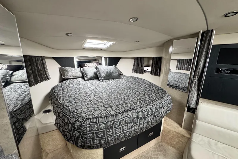 Slide: The Image of Luxurious interior of 2005 Formula 34 Performance Cruiser with elegant bedding and modern design. - 38