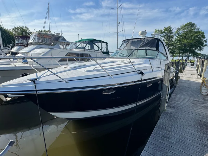 Slide: The Image of 2005 Formula 34 PC yacht interior with white seating and helm, featuring a spacious cockpit. - 5