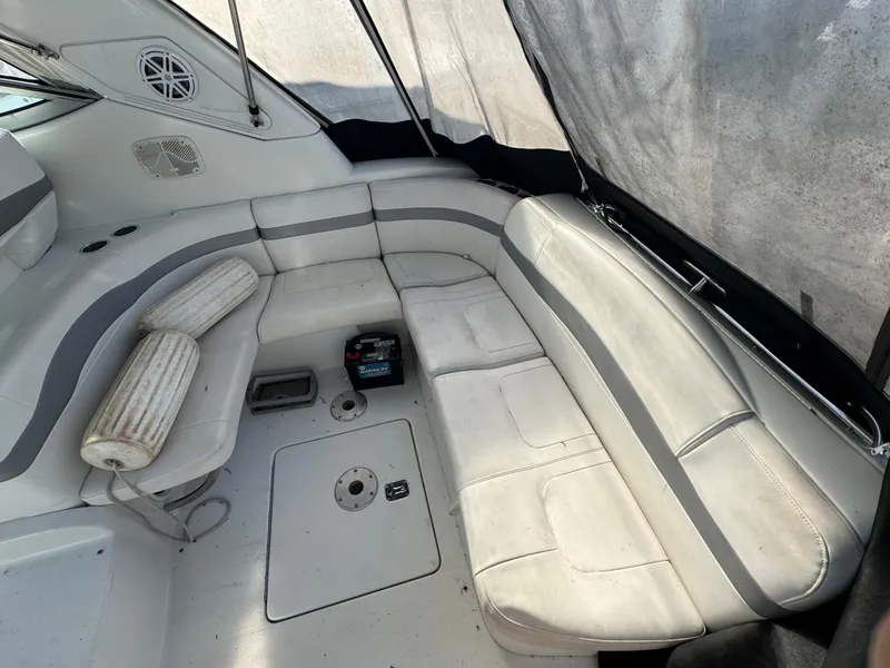 Slide: The Image of 2005 Formula 34 PC boat interior with helm, seating, and clear canopy. - 6
