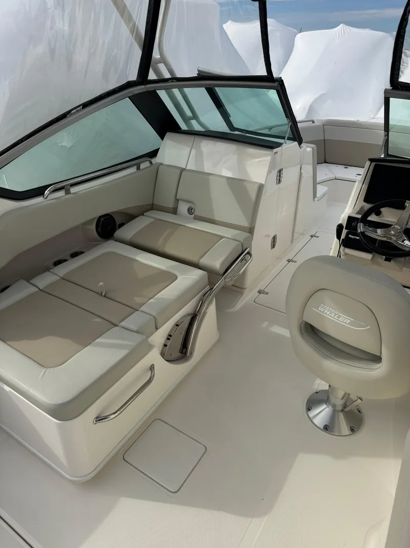 Slide: The Image of 2022 Boston Whaler 240 Vantage interior with plush seating and modern helm. - 12