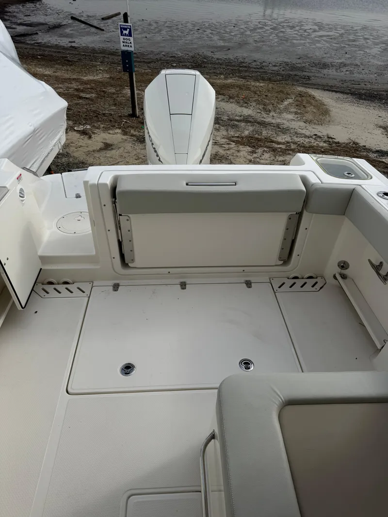 Slide: The Image of 2022 Boston Whaler 240 Vantage boat interior, featuring spacious seating and clean design. - 14