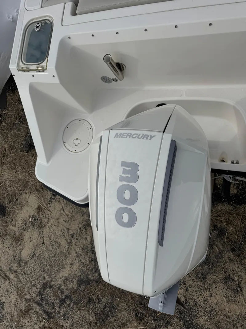 Slide: The Image of 2022 Boston Whaler 240 Vantage with Mercury 300 outboard engine, rear view. - 17