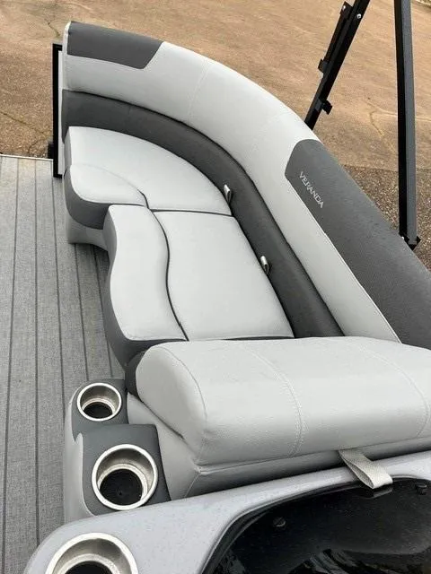 Slide: The Image of 2025 Veranda VF22F2 Deluxe boat seating with cup holders, featuring sleek gray upholstery. - 12