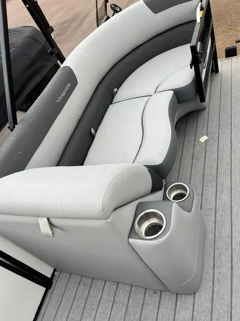Slide: The Image of 2025 Veranda VF22F2 Deluxe boat seating with cup holders, featuring sleek gray upholstery. - 4