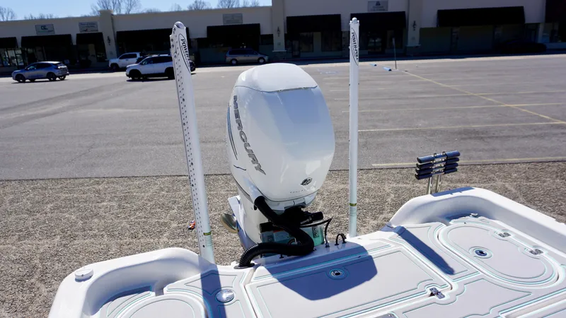 Slide: The Image of 2022 Blue Wave 2600 PureBay boat with outboard motor in parking lot. - 11