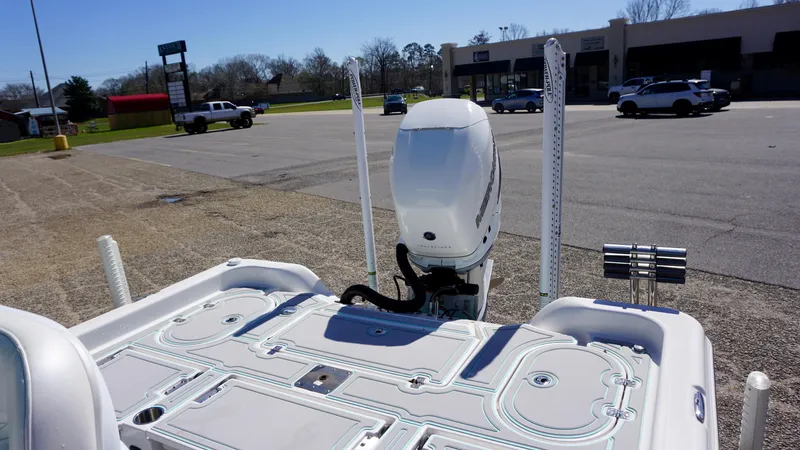 Slide: The Image of 2022 Blue Wave 2600 PureBay boat with outboard motor in parking lot. - 12