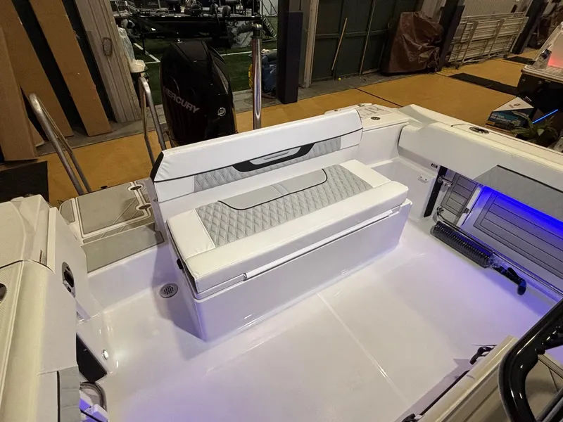 Slide: The Image of 2025 Blackfin 222 CC boat interior with cushioned seating and modern design. - 3