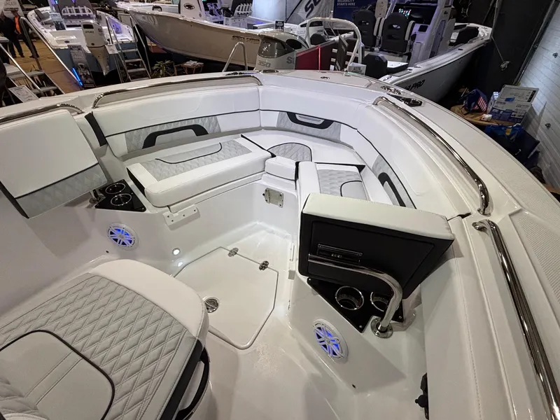 Slide: The Image of 2025 Blackfin 222 CC boat interior with white seating and modern design. - 8