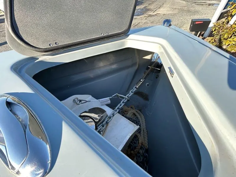 Slide: The Image of Open anchor compartment of 2024 Glasstream 32 GSX boat with chain and rope. - 29