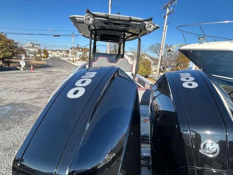 Slide: The Image of 2024 Glasstream 32 GSX boat with dual 300 horsepower engines, parked outdoors. - 10