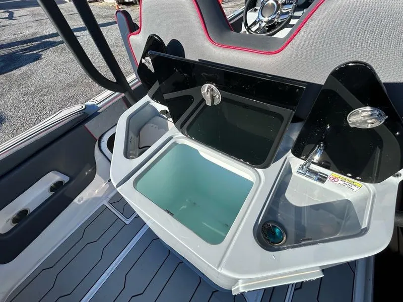 Slide: The Image of 2024 Glasstream 32 GSX boat interior with open storage compartment and sleek design. - 16
